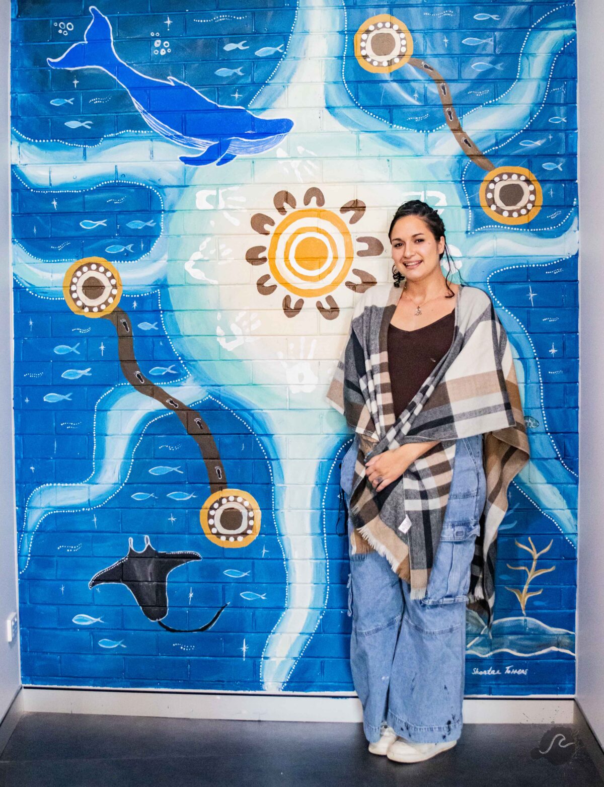 Shontae in front of her Mural at headspace Coffs
